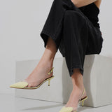 Coeur 55 yellow patent slingback pumps