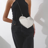 Le Coeur brass crossbody bag