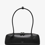 Black handbag with a bow detail on a white background