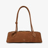 Brown handbag with a visible brand logo on a white background