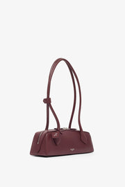 Le Teckel small dark red leather bag