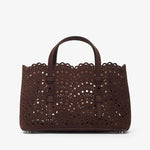 Brown laser-cut handbag on a white background
