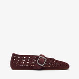 Black leather loafers on a light gray background