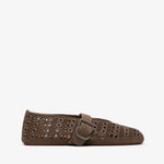 Brown loafers with decorative holes and a buckle on a white background