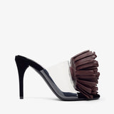 High-heeled shoe with a decorative flower on a white background