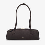 Black handbag with a strap on a white background