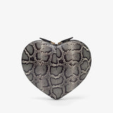 Heart-shaped clutch with snake skin pattern on a white background