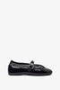 Black rubber ballet flats