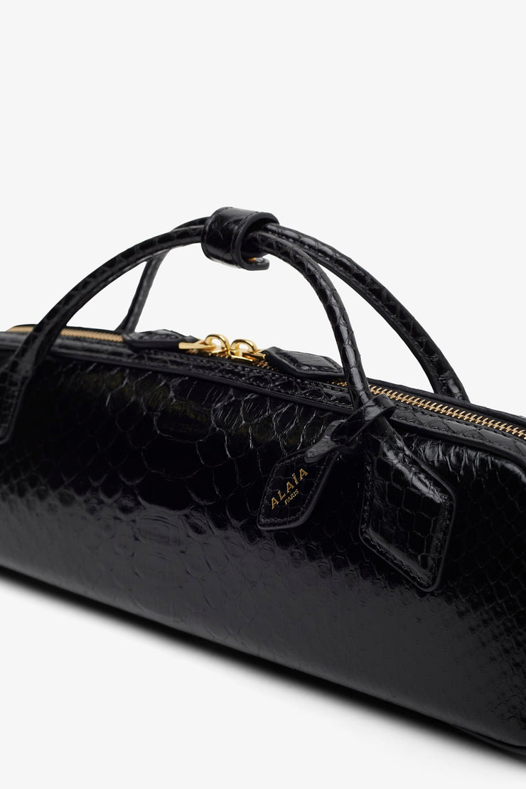 Le Teckel black shiny python clutch