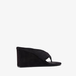 Black wedge sandal on a white background