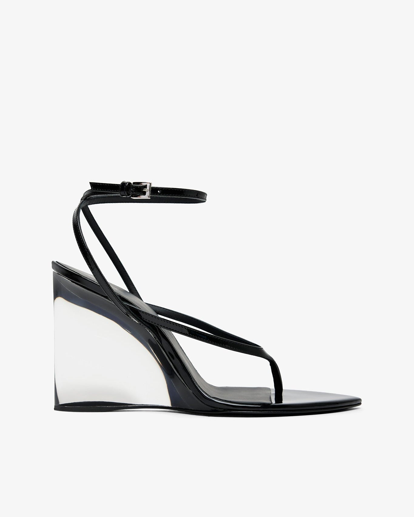 Black wedge sandal with transparent sole on a white background