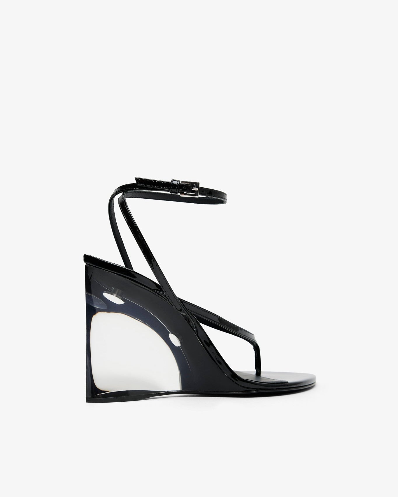 Black high-heeled sandal with clear heel on a white background