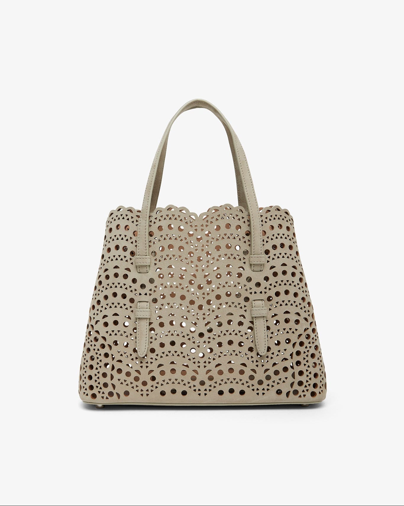 Beige handbag with decorative studs on a white background
