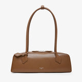 Brown handbag on a light beige background