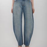 Round faded blue jeans