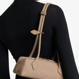 Le teckel small light taupe suede bag