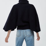 Short dark blue turtleneck cape