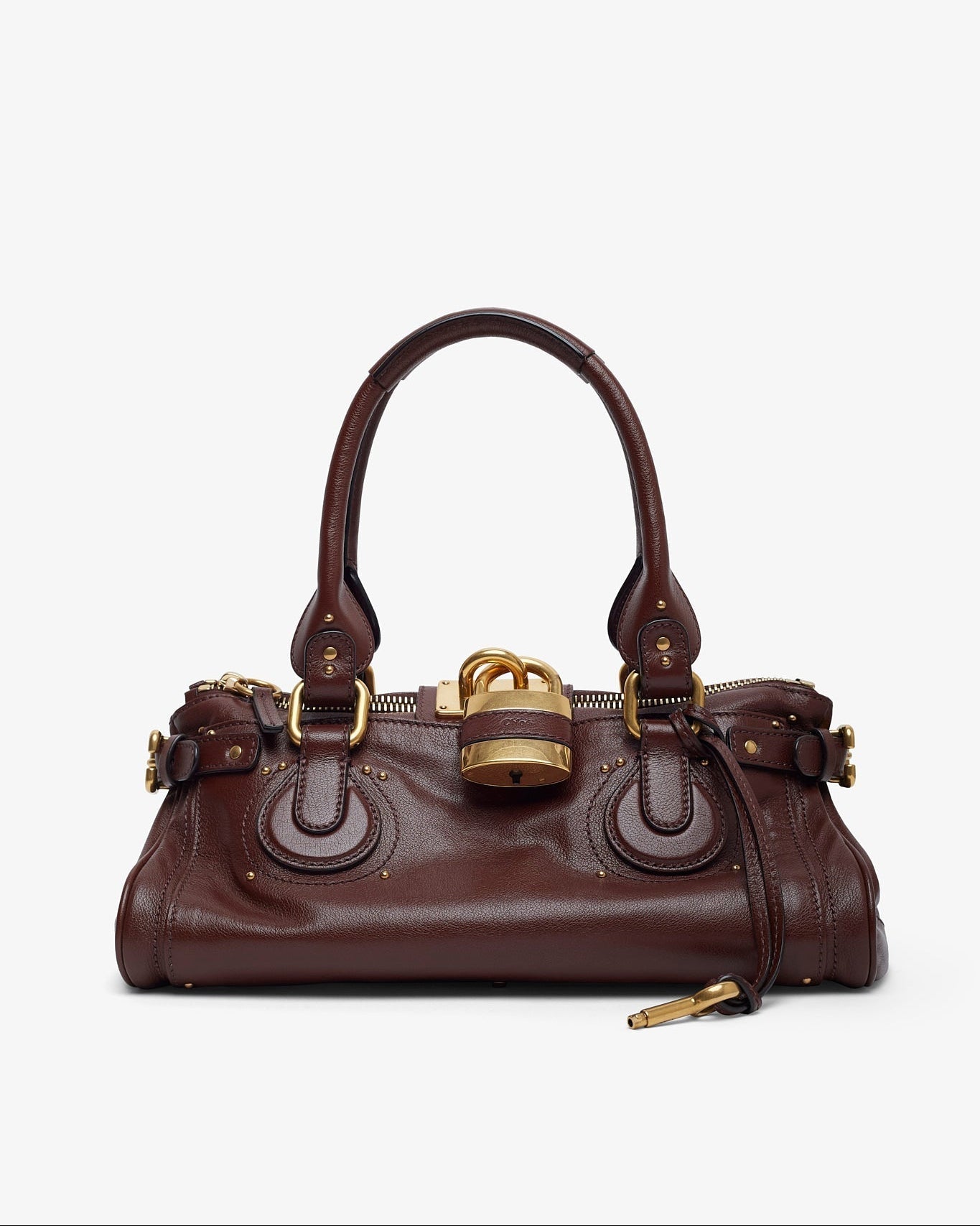 Brown leather handbag with gold accents on a white background