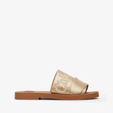 Gold slide sandal with brand logo on a white background