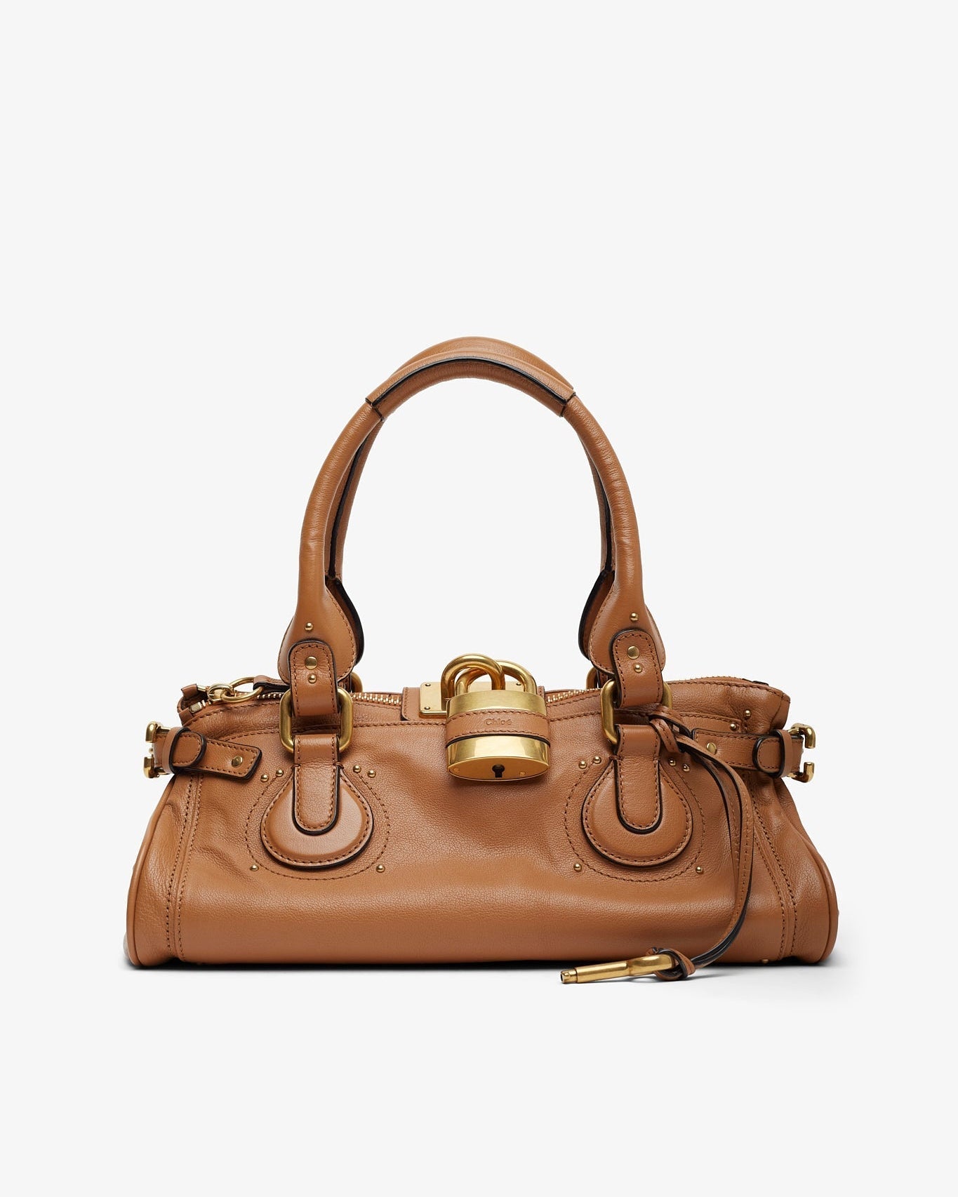 Brown handbag with gold accents on a white background