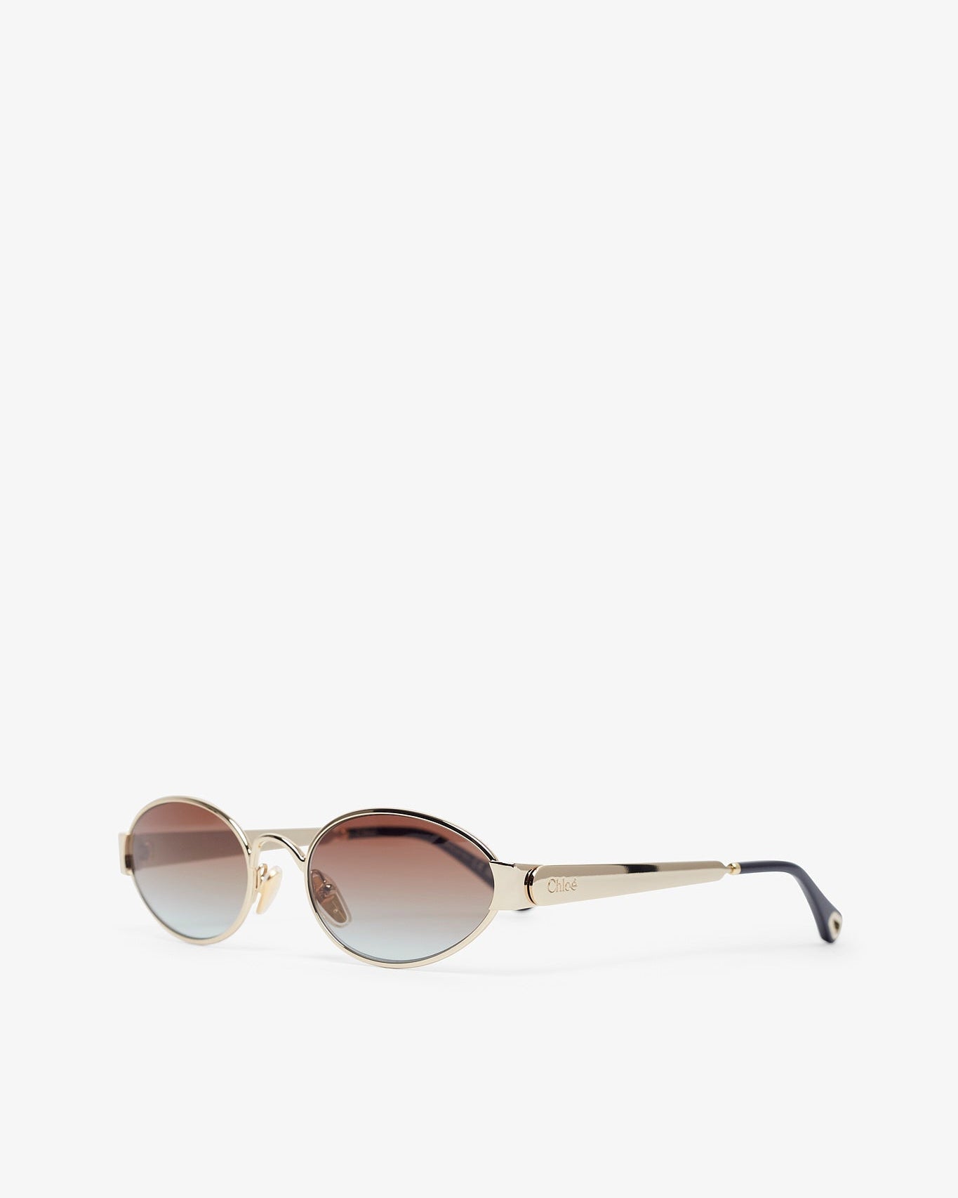 Sunglasses with gradient lenses on a white background