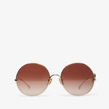 Round sunglasses with a gradient brown lens on a white background