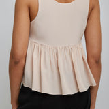 Delicate pink peplum silk top