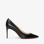Black high-heeled shoe on a light gray background