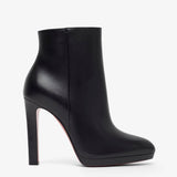 Black high-heeled ankle boot on a white background