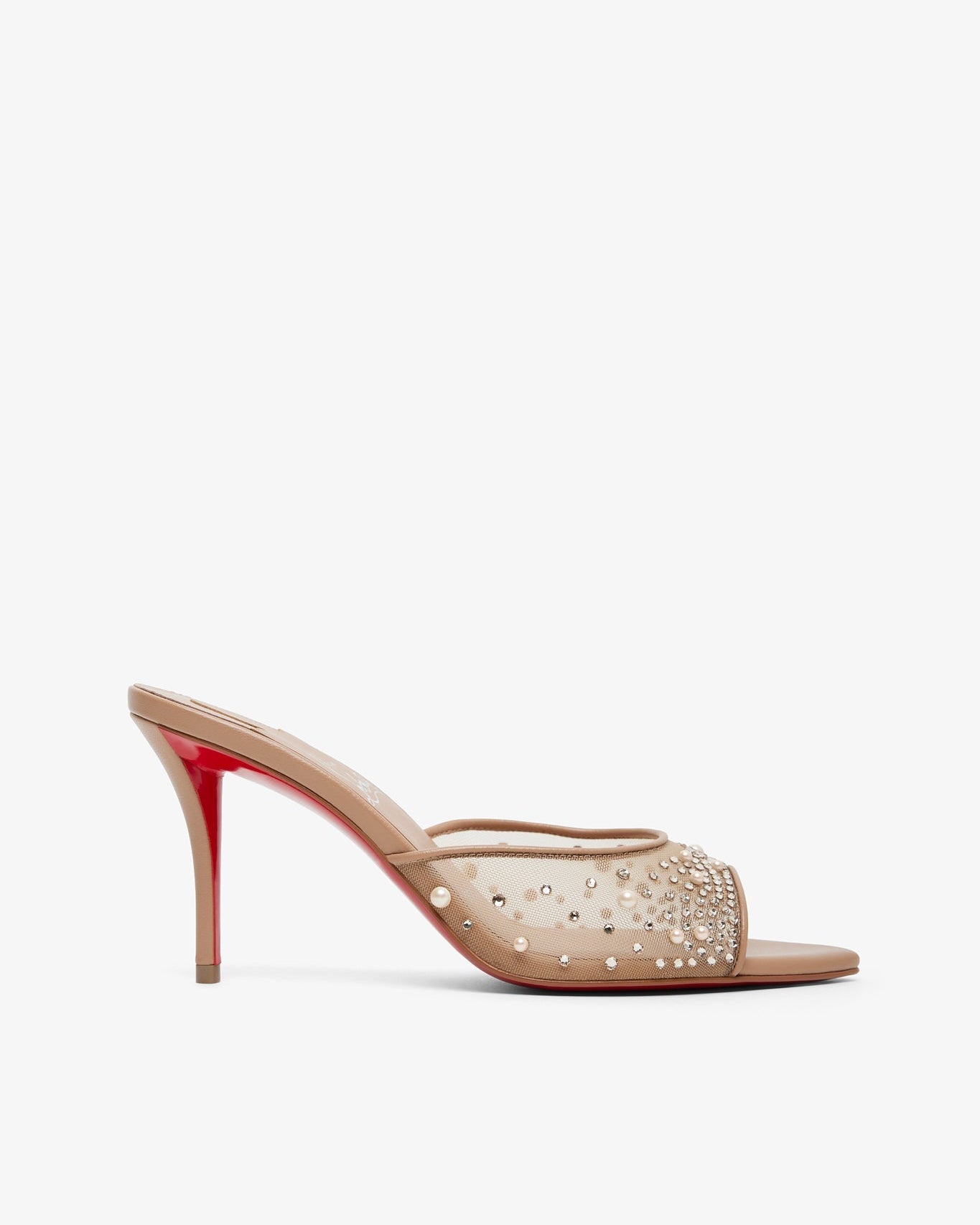 High-heeled shoe with red sole and clear embellishments on a white background