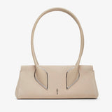 Beige handbag with unique handle design on a white background