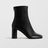 Phoebe Philo Tug black leather ankle boots