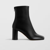 Tug black leather ankle boots