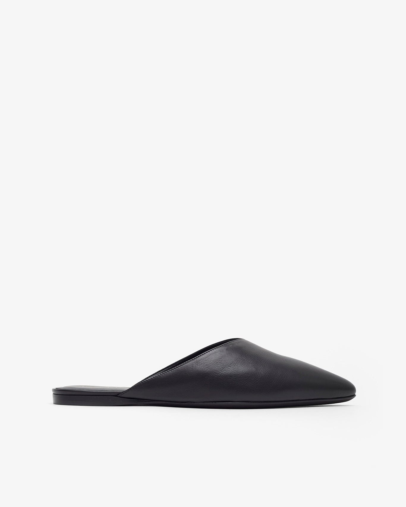 Black slip-on shoe on a white background