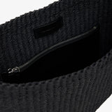 Dark textured fabric with a zipper on a white background