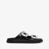 Black slide sandal with crystal embellishments on a white background