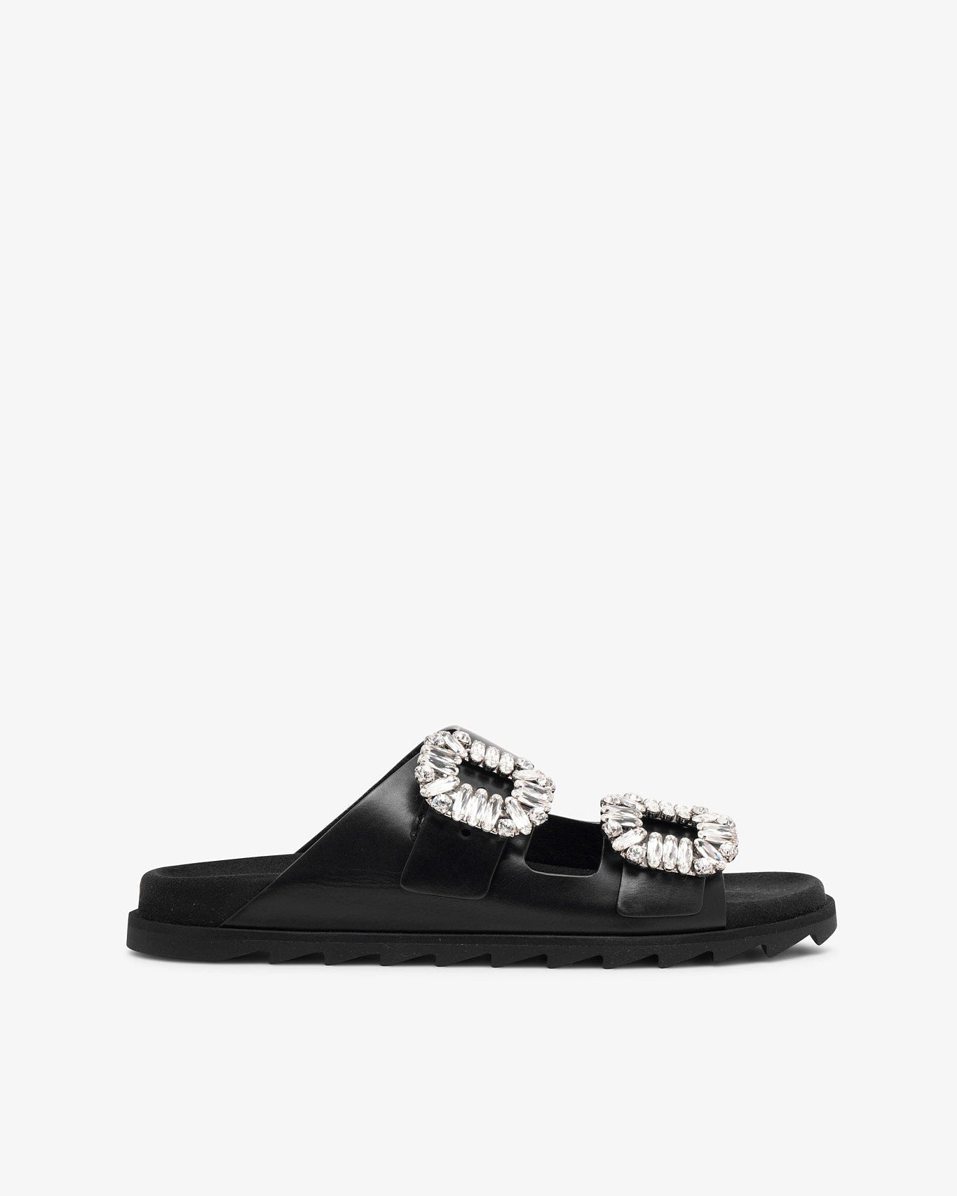 Black slide sandal with crystal embellishments on a white background