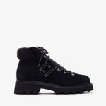 Black boot with fur trim on a white background