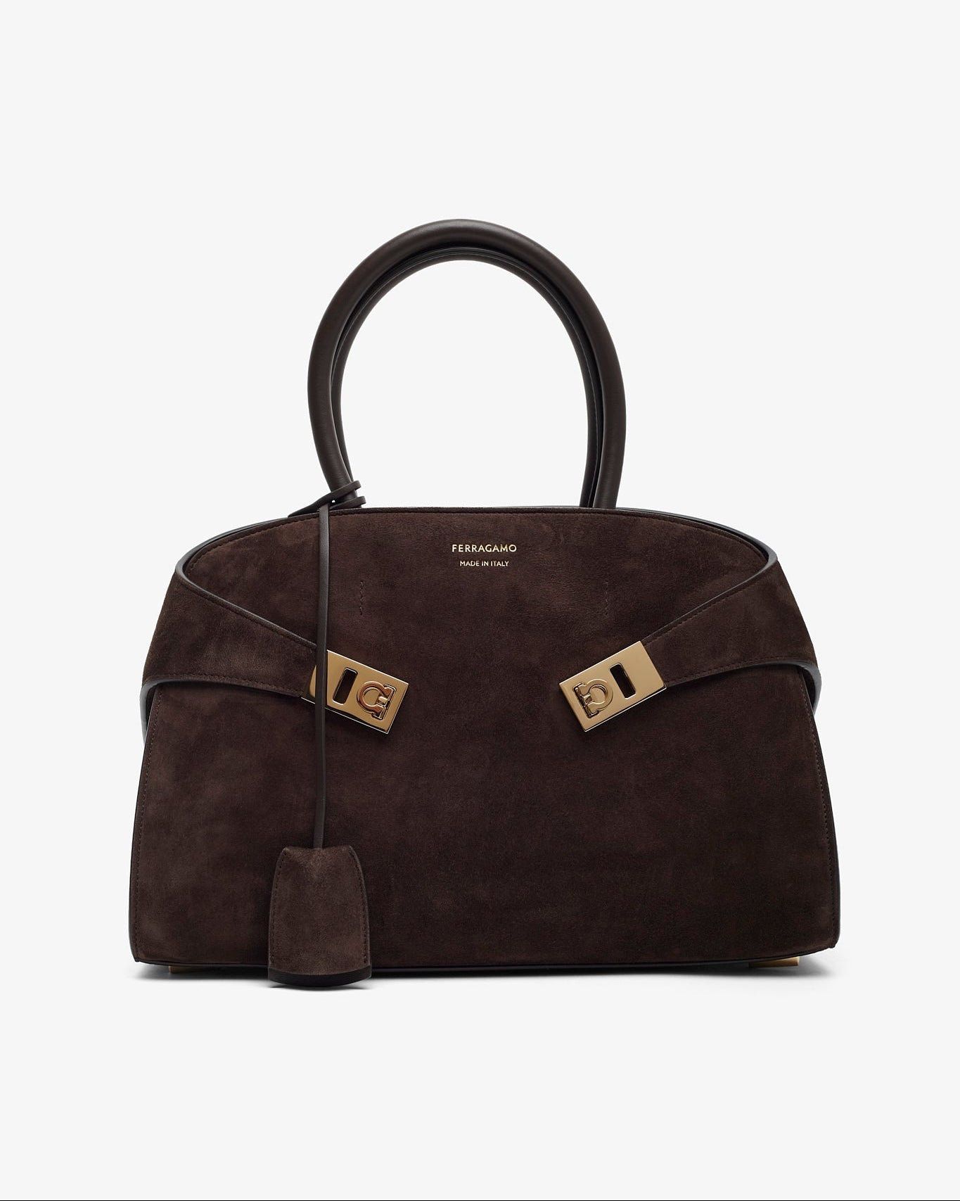 Brown handbag with gold hardware on a white background