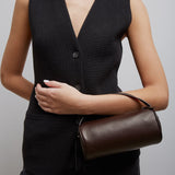 Round 90's dark brown leather bag