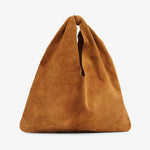 Brown suede handbag on a light gray background