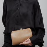 Amazon beige shiny leather clutch