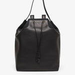 Black leather backpack on a white background