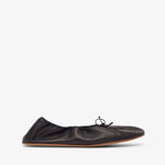 Black leather flat shoe on a white background