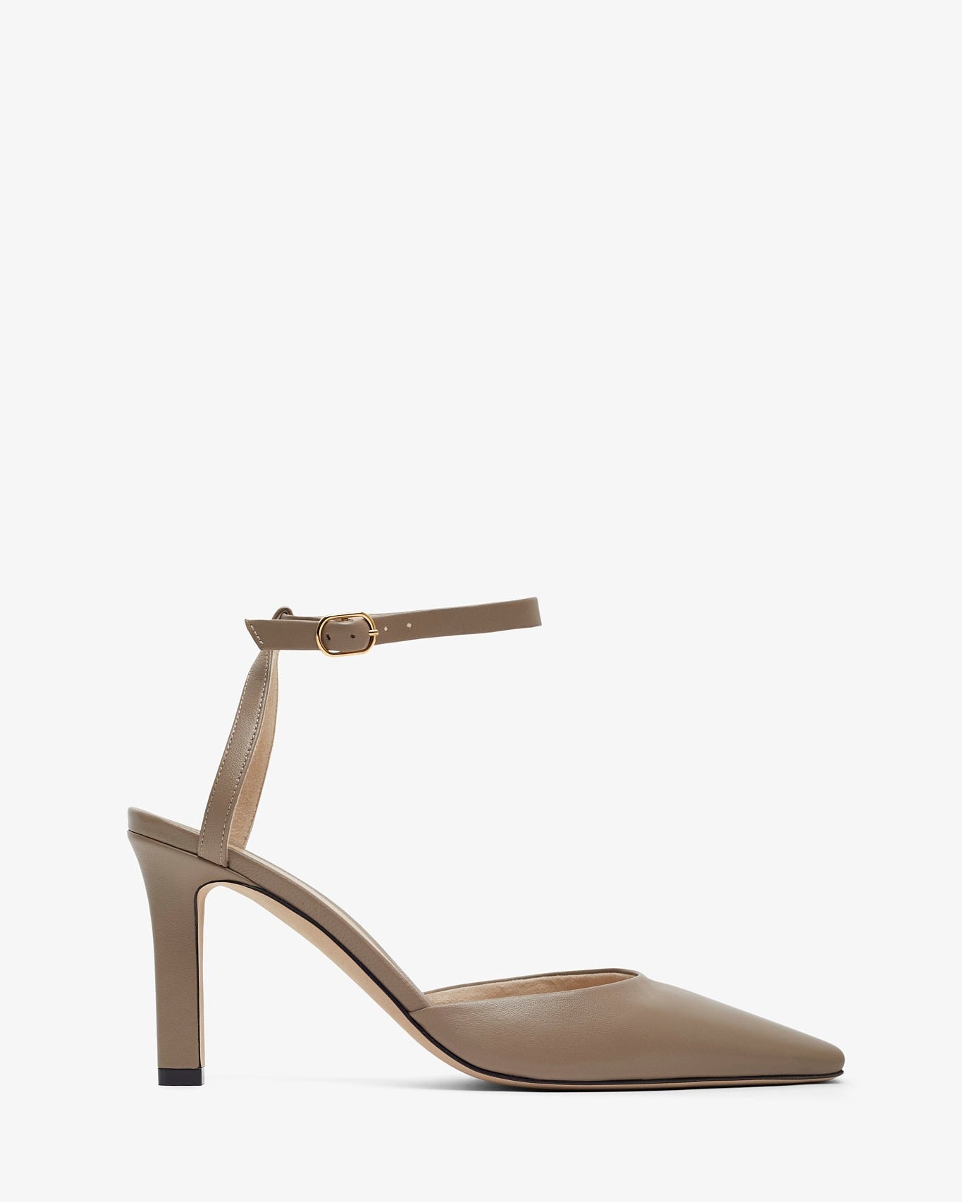 Beige high-heeled shoe with a thin strap on a white background