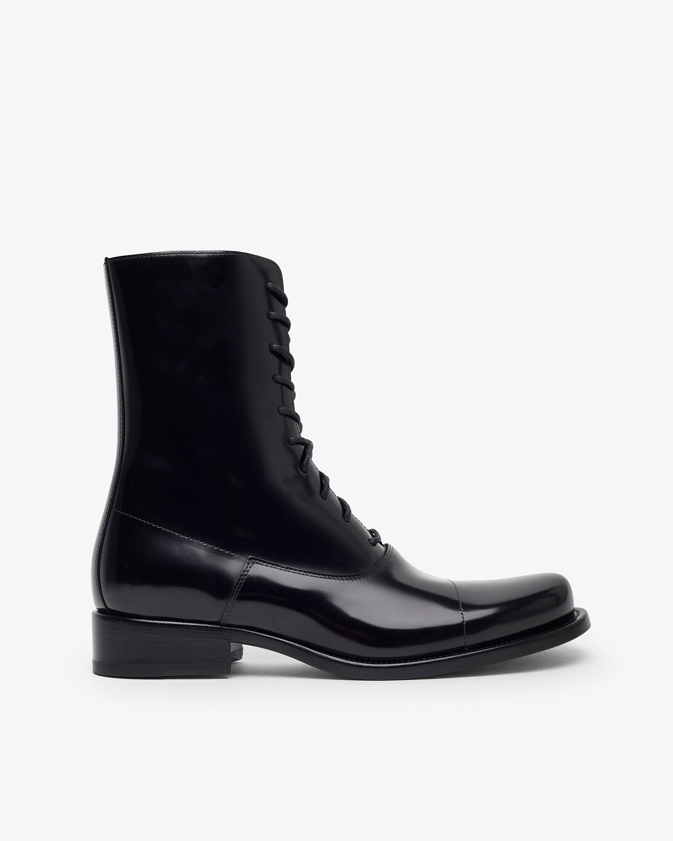 Black leather boot on a white background