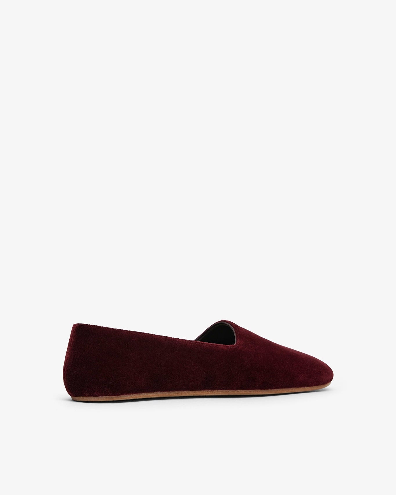 Burgundy velvet loafer on a white background