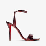 Red high-heeled sandal on a white background