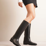 Grunge riding black leather boots