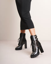Perforated combat ankle boots